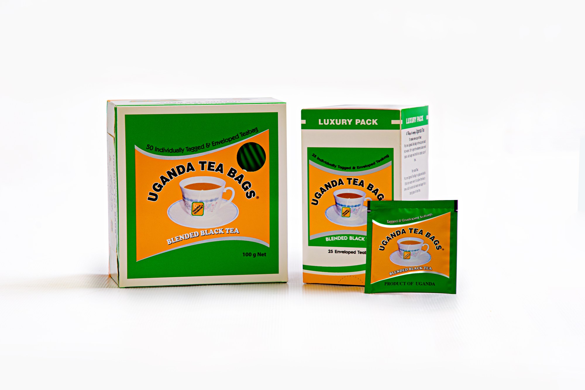 Uganda Tea Bags Luxury Pack — 50-bag and 25-bag enveloped boxes with an individually wrapped tagged tea bag