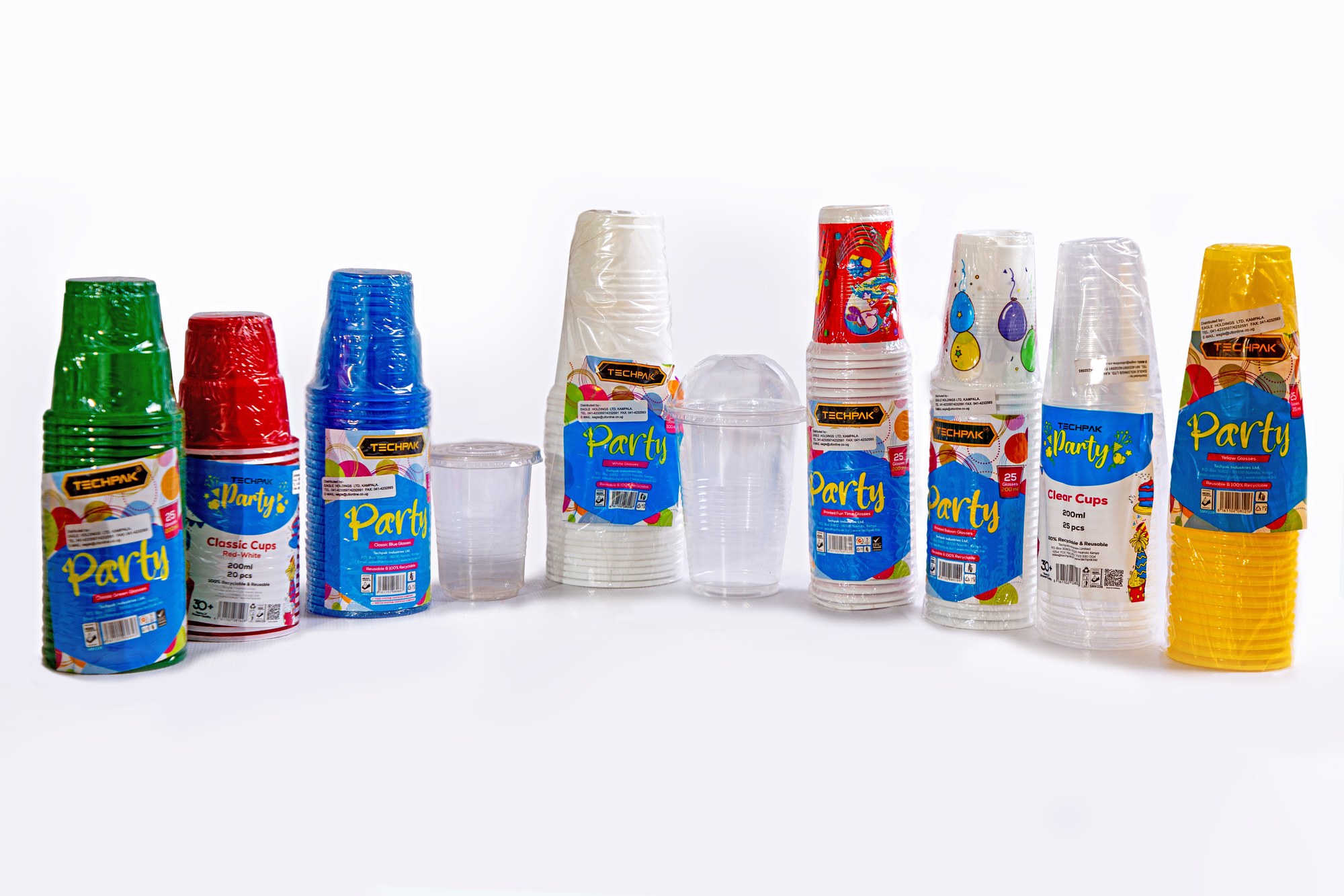 Techpak glass range on retail shelves — Plain, Classic and Designed glasses in white, clear, blue, green, red, yellow and printed Party finishes
